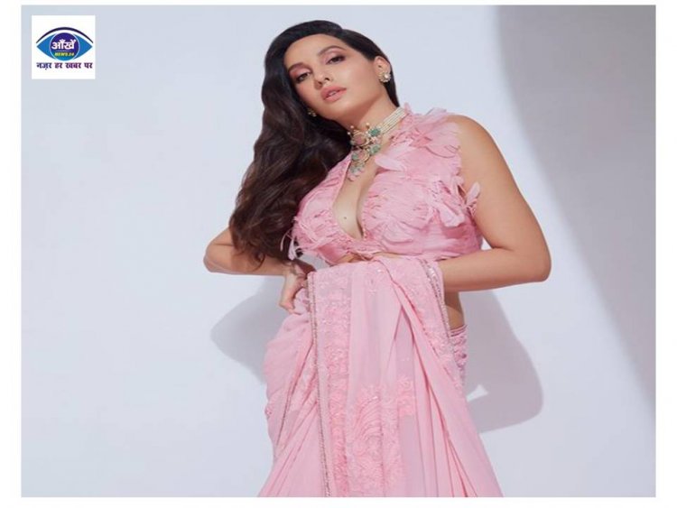 पिंक साड़ी पहन Nora Fatehi ने दिखाया तिल, फैंस के उड़े होश 